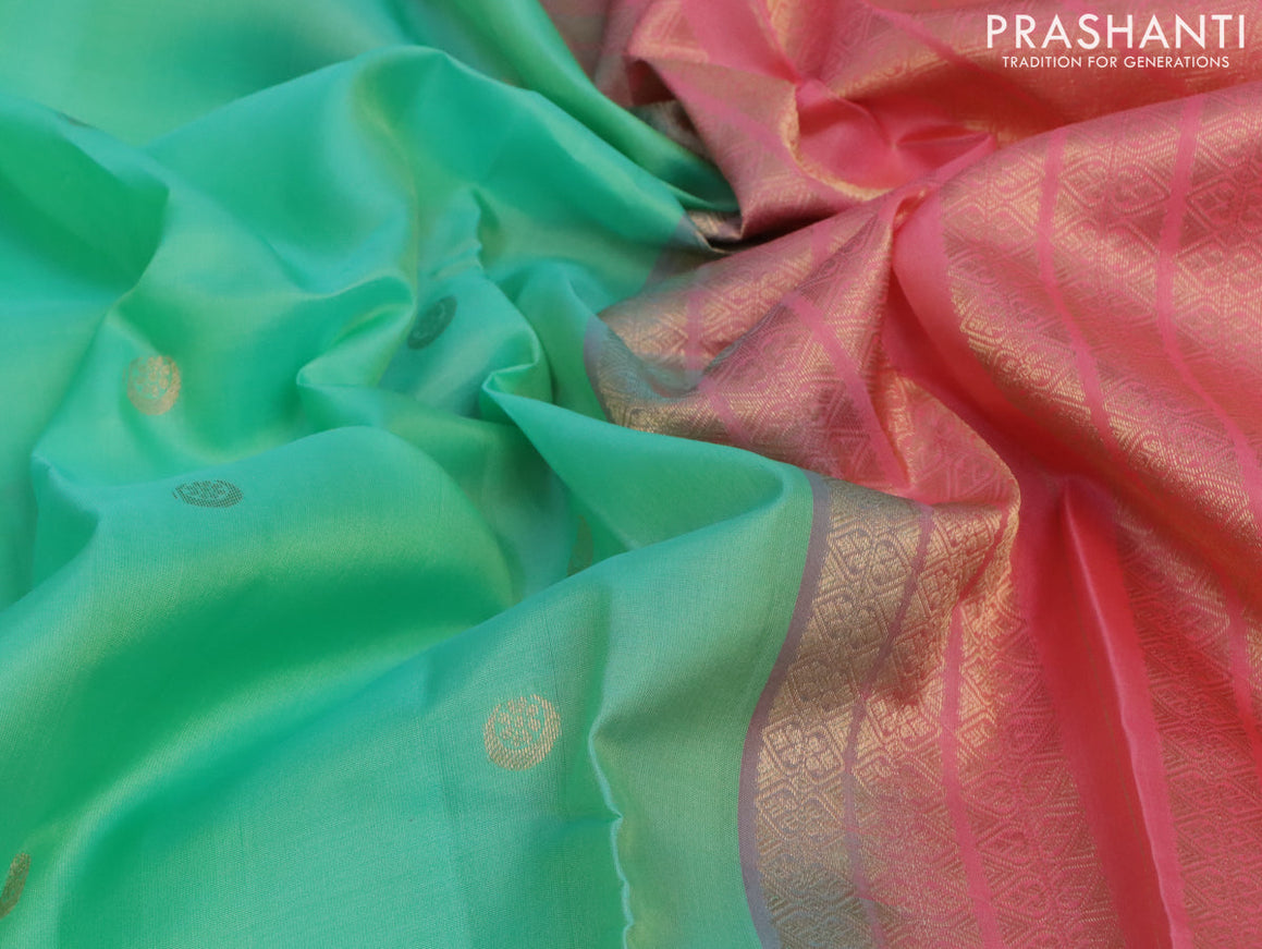 Pure kanjivaram silk saree teal green and peach pink with zari woven buttas and zari woven border & Butta style