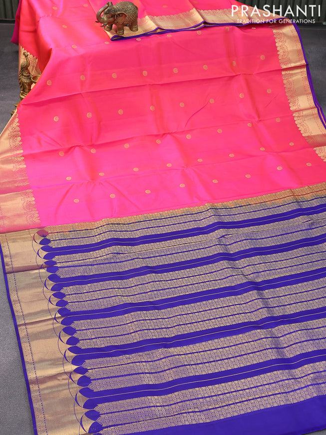 Pure kanjivaram silk saree dual shade of pinkish orange and blue with zari woven buttas and zari woven border & Butta style