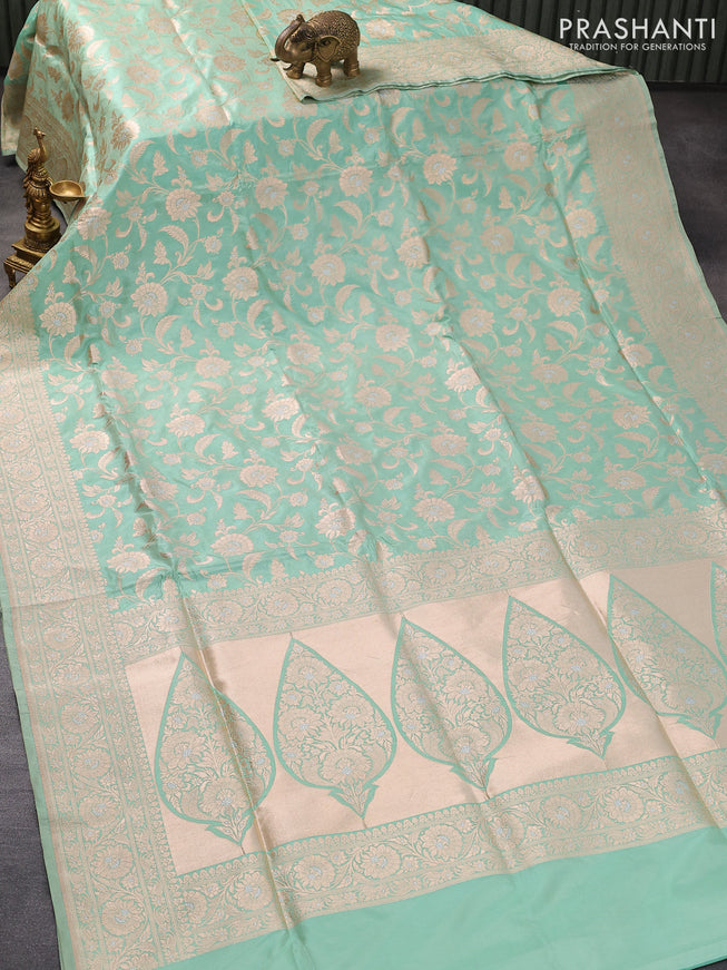Banarasi uppada silk saree pastel green shade with allover floral zari woven brocade weaves and rich floral zari woven border