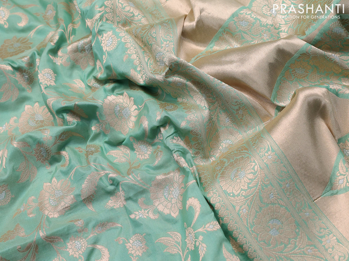 Banarasi uppada silk saree pastel green shade with allover floral zari woven brocade weaves and rich floral zari woven border