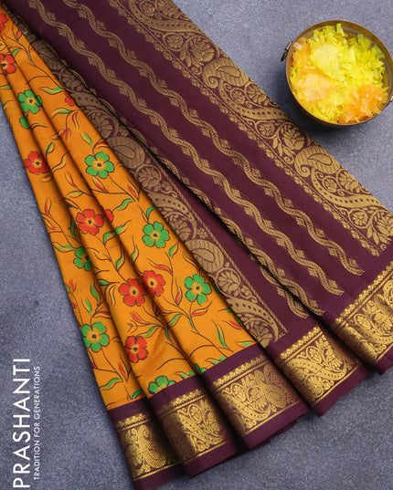 Silk cotton saree mustard yellow and brown with allover floral prints and zari woven border