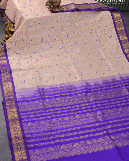 Silk cotton saree sandal and blue with allover floral prints and zari woven border
