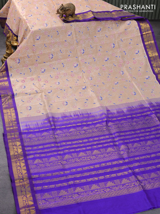 Silk cotton saree sandal and blue with allover floral prints and zari woven border