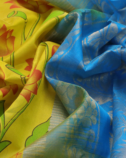 Silk cotton saree yellow and cs blue with allover pichwai prints and floral zari woven border