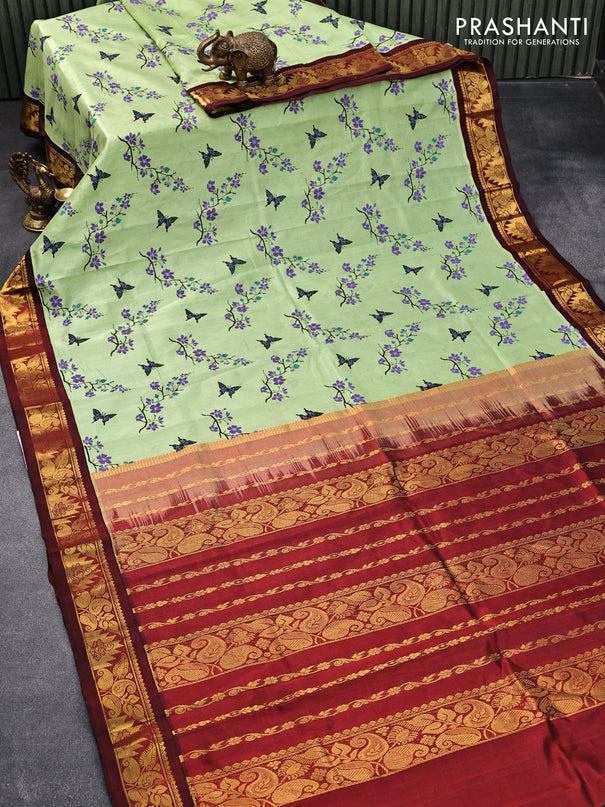 Silk cotton saree pista green and maroon with allover floral prints and zari woven border