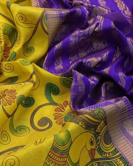 Silk cotton saree yellow and blue with allover kalamakri prints and zari woven border