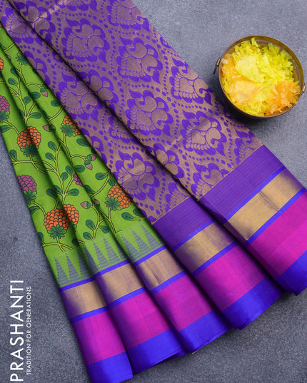 Silk cotton saree light green and blue with allover prints and temple design zari woven simple border