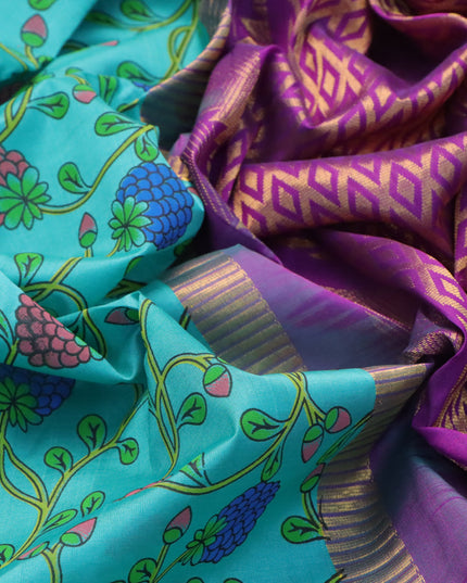 Silk cotton saree teal blue and purple with allover prints and temple design zari woven simple border