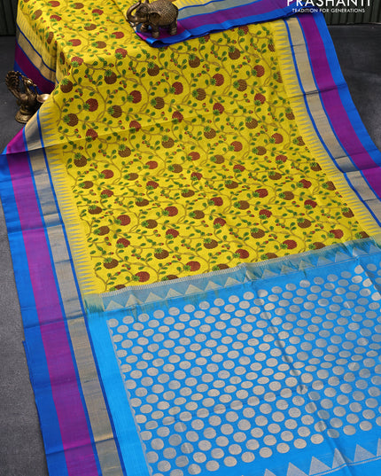 Silk cotton saree yellow and cs blue with allover prints and temple design zari woven border