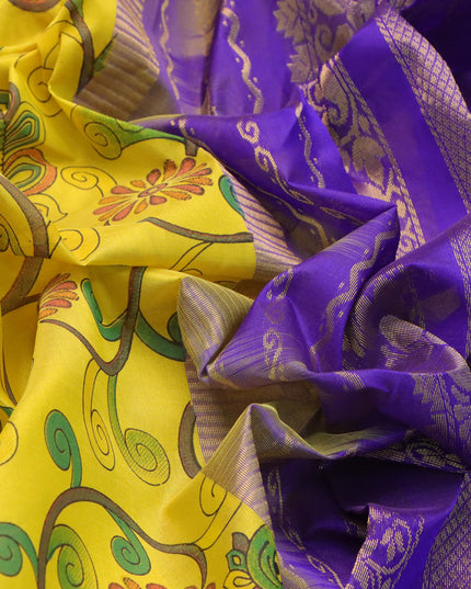 Silk cotton saree yellow and blue with allover kalamkari prints and rettapet zari woven border