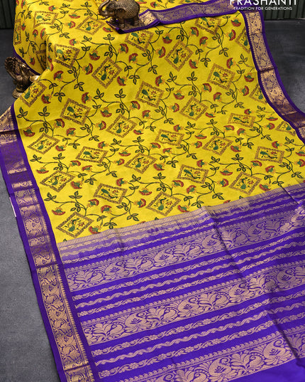 Silk cotton saree yellow and violet with allover kalamkari prints and zari woven border