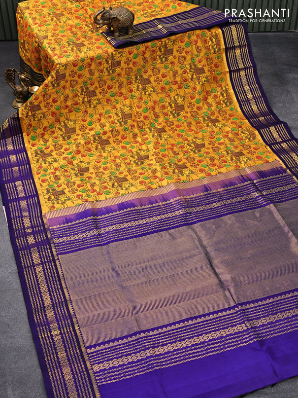 Silk cotton saree mustard yellow and blue with allover kalamkari prints and zari woven border