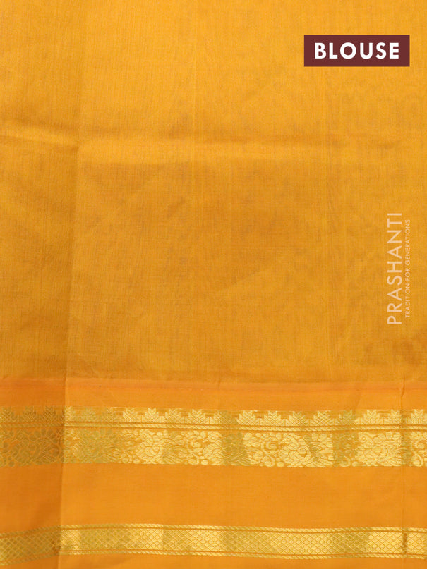 Silk cotton saree blue and mustard yellow with allover floral prints and rettapet zari woven border