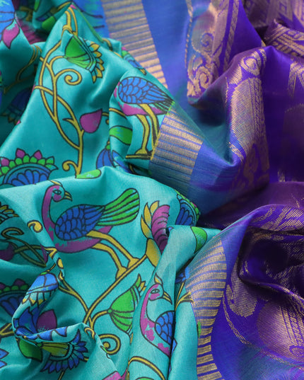 Silk cotton saree teal blue and blue with allover kalamkari prints and temple design zari woven simple border