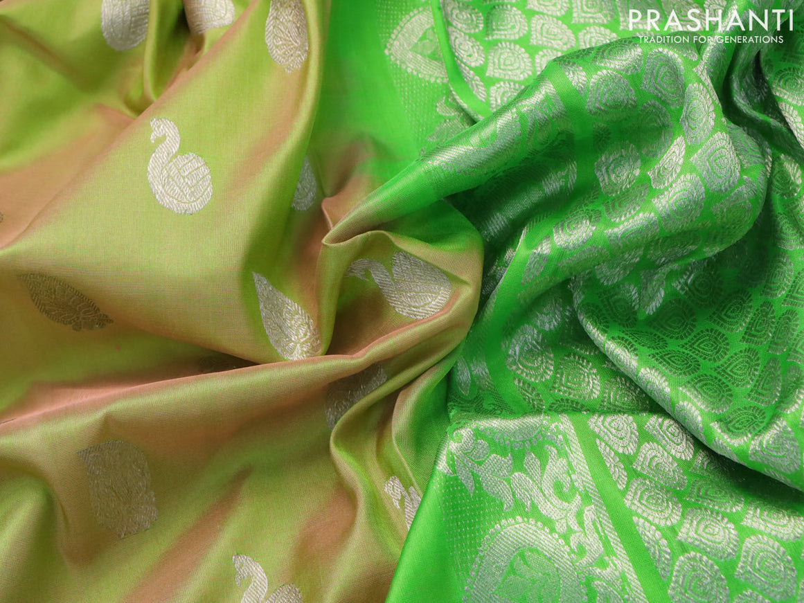 Venkatagiri silk saree dual shade of light greenish pink and parrot green with silver zari woven buttas and peacock silver zari woven border