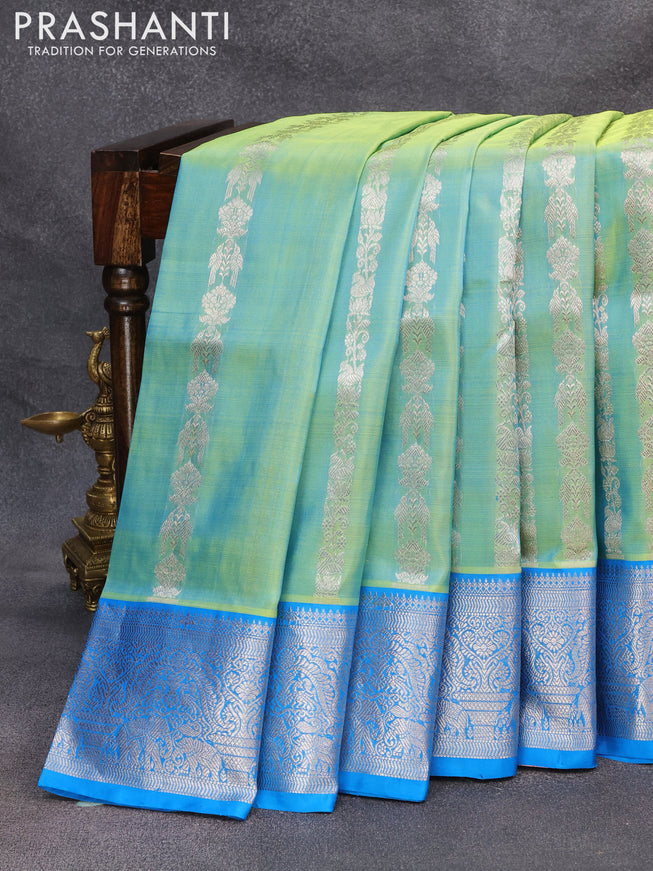 Venkatagiri silk saree dual shade of teal green and cs blue with allover silver zari weaves and silver zari woven border