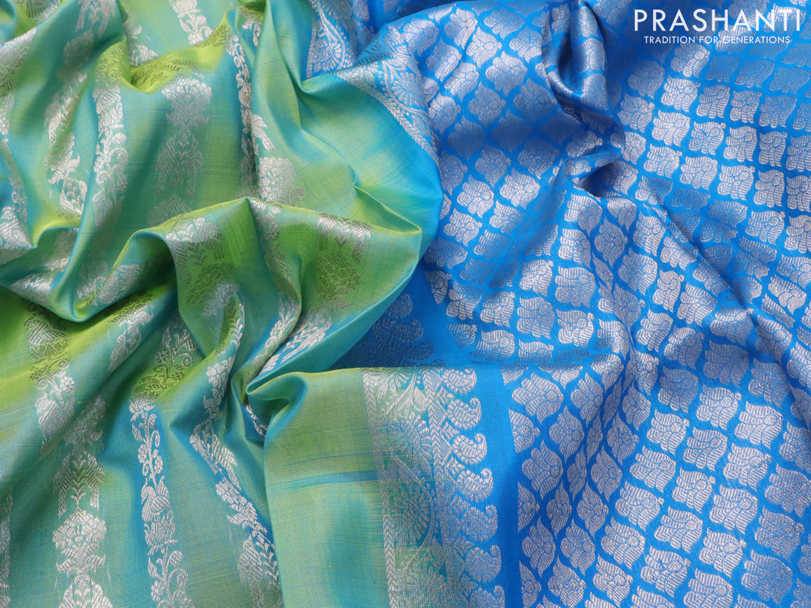 Venkatagiri silk saree dual shade of teal green and cs blue with allover silver zari weaves and silver zari woven border