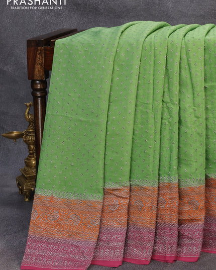 Pure banarasi crepe silk saree green shade and orange wine shade with allover thread & silver zari woven buttas and woven border