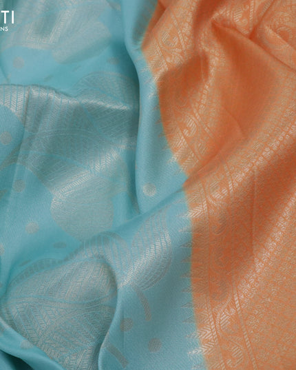 Banarasi softy silk saree light blue and peach orange with allover zari weaves and zari woven border