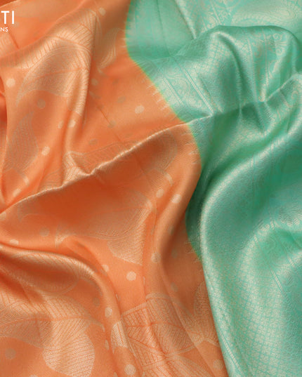 Banarasi softy silk saree peach orange and teal green with allover zari weaves and silver zari woven border