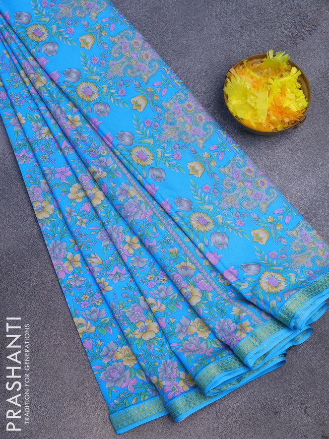 Semi crepe saree blue with allover floral prints and zari woven border