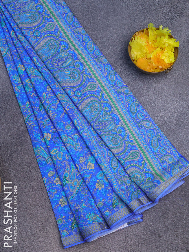 Semi crepe saree blue with allover prints and zari woven border