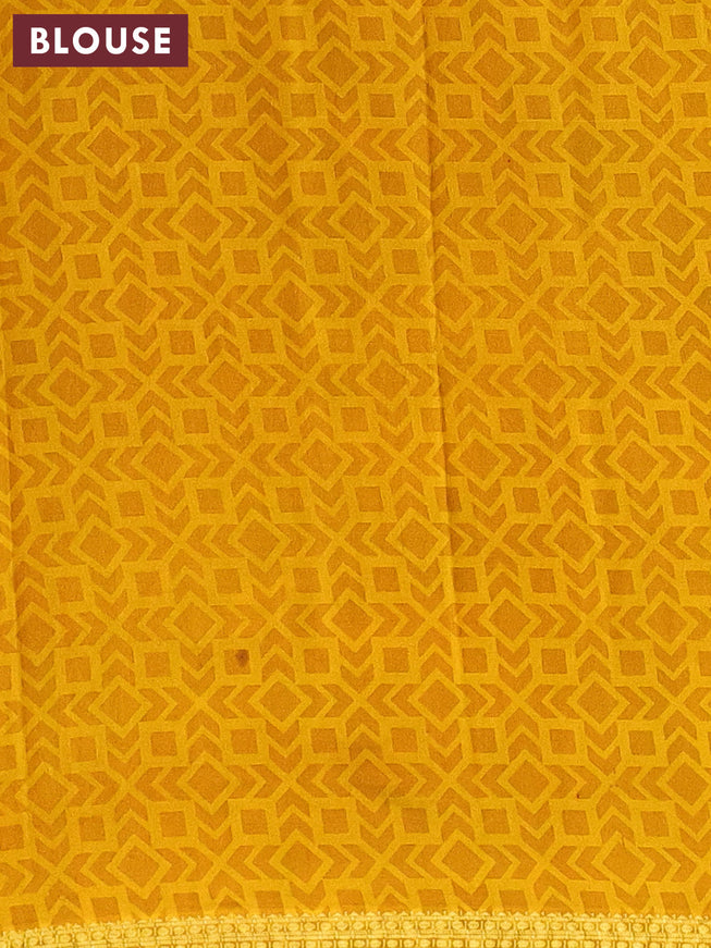 Semi crepe saree green and mustard yellow with allover paisley prints and zari woven border