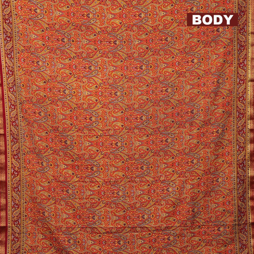 Semi crepe saree orange and maroon with allover paisley prints and zari woven border