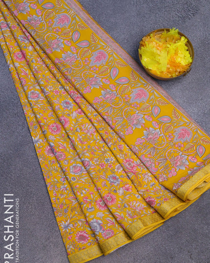 Semi crepe saree yellow with allover floral prints and zari woven border