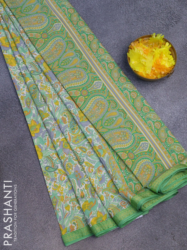 Semi crepe saree off white and light green with allover prints and zari woven border