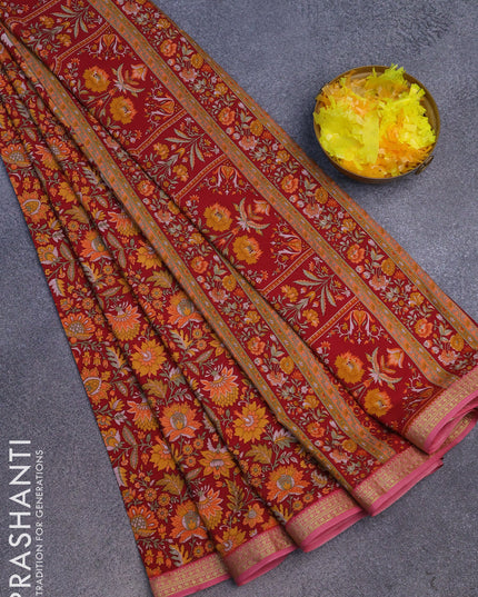 Semi crepe saree maroon and pink shade with allover floral prints and zari woven border