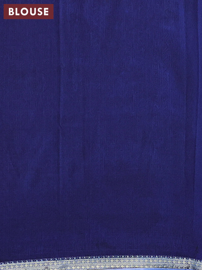 Semi crepe saree blue with allover floral prints and zari woven border