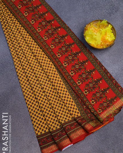 Semi crepe saree pale orange and red with allover floral prints and zari woven border