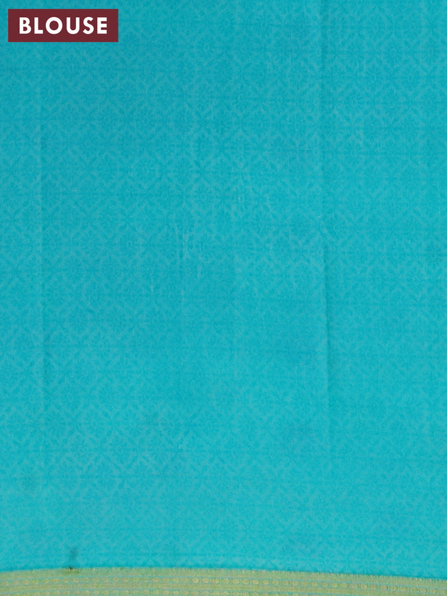 Semi crepe saree teal blue with allover prints and zari woven border