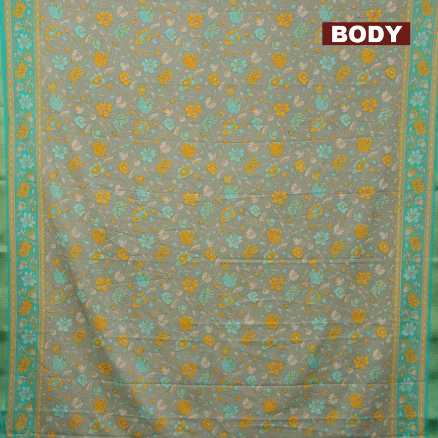 Semi crepe saree pastel green and teal green with floral prints and zari woven border