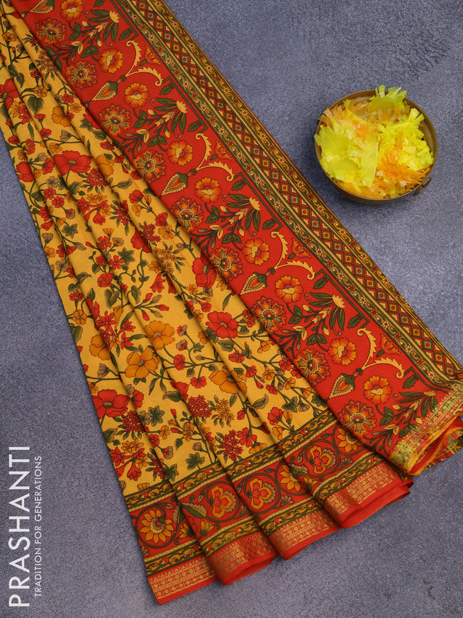 Semi crepe saree pale orange and red with floral prints and zari woven border
