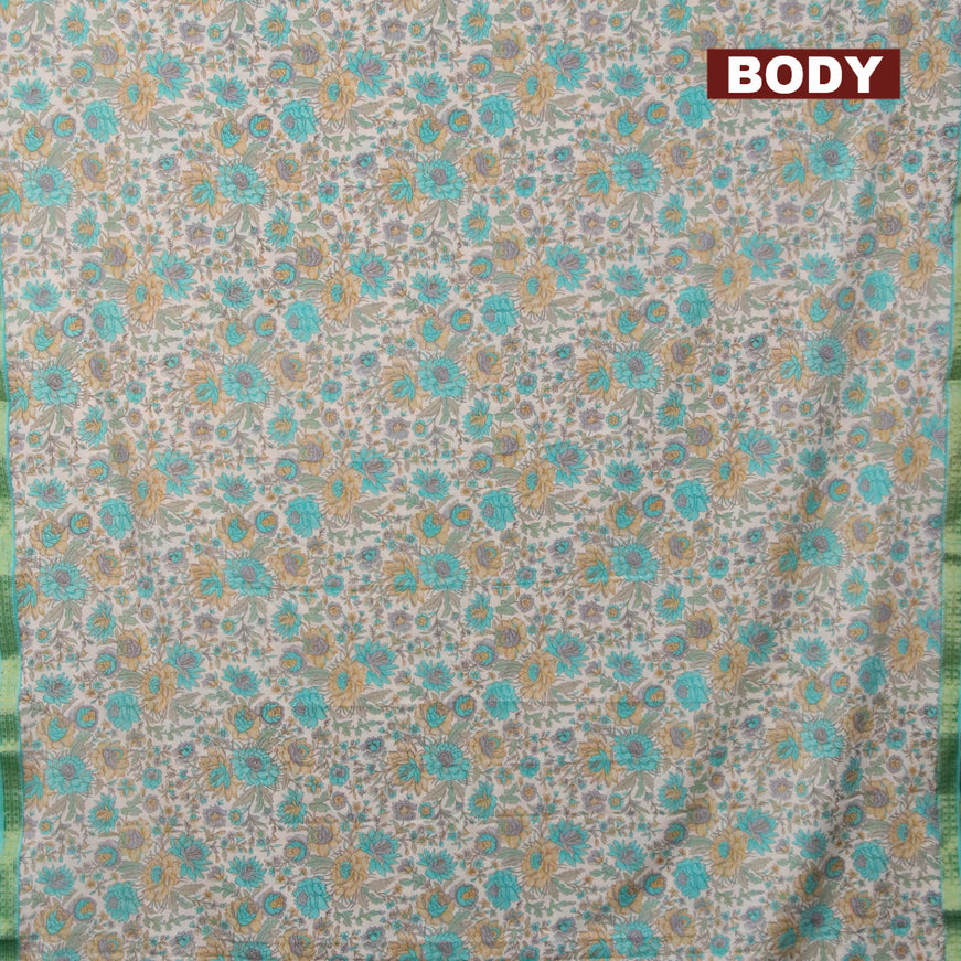 Semi crepe saree off white and teal shade with floral prints and zari woven border