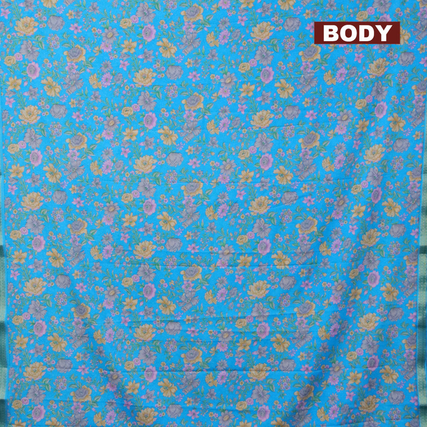 Semi crepe saree cs blue with floral prints and zari woven border