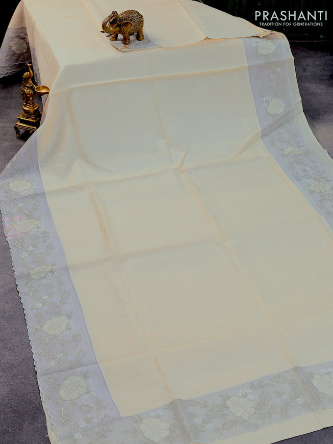 Pure tussar silk saree off white and grey with plain body and floral embroidery work border