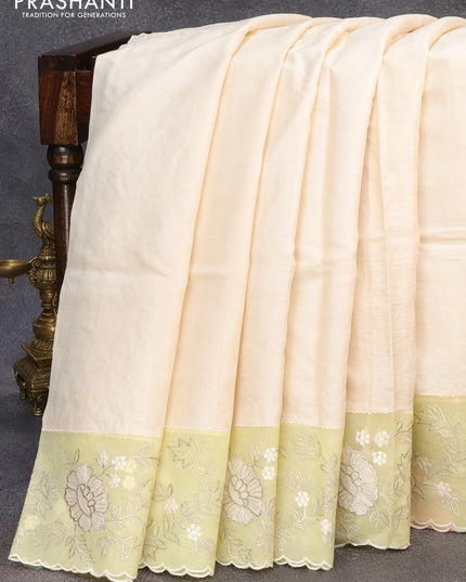 Pure tussar silk saree off white and pale yellow with plain body and floral embroidery work border