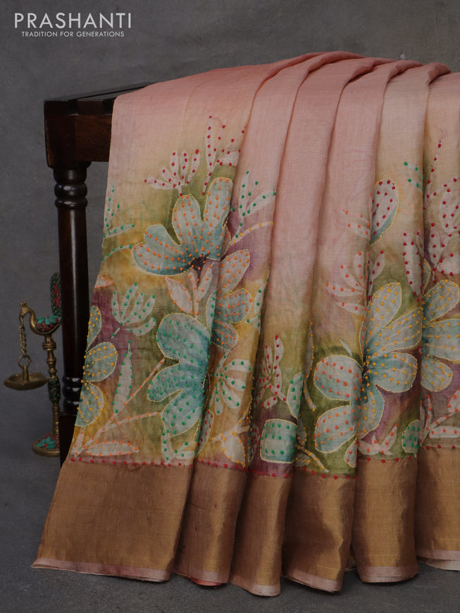 Pure tussar silk saree multi colour and pastel peach with allover floral prints & french knot work and zari woven border