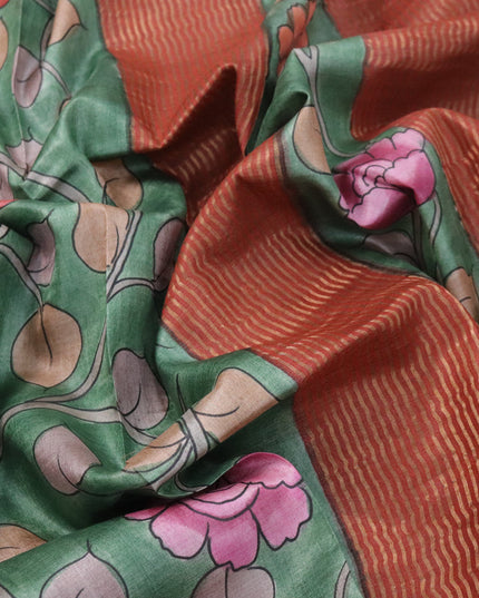 Pure tussar silk saree green and rust orange with allover hand painted kalamkari prints and zari woven border