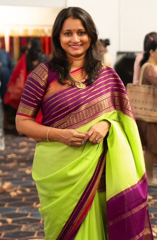 Pure mysore silk saree fluorescent green and purple with plain body and long rich zari woven border