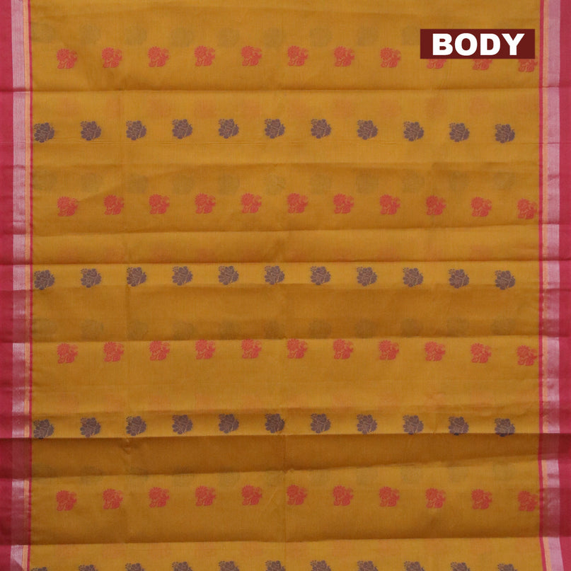 Nithyam cotton saree mustard yellow and pink with allover thread woven buttas and zari woven simple border