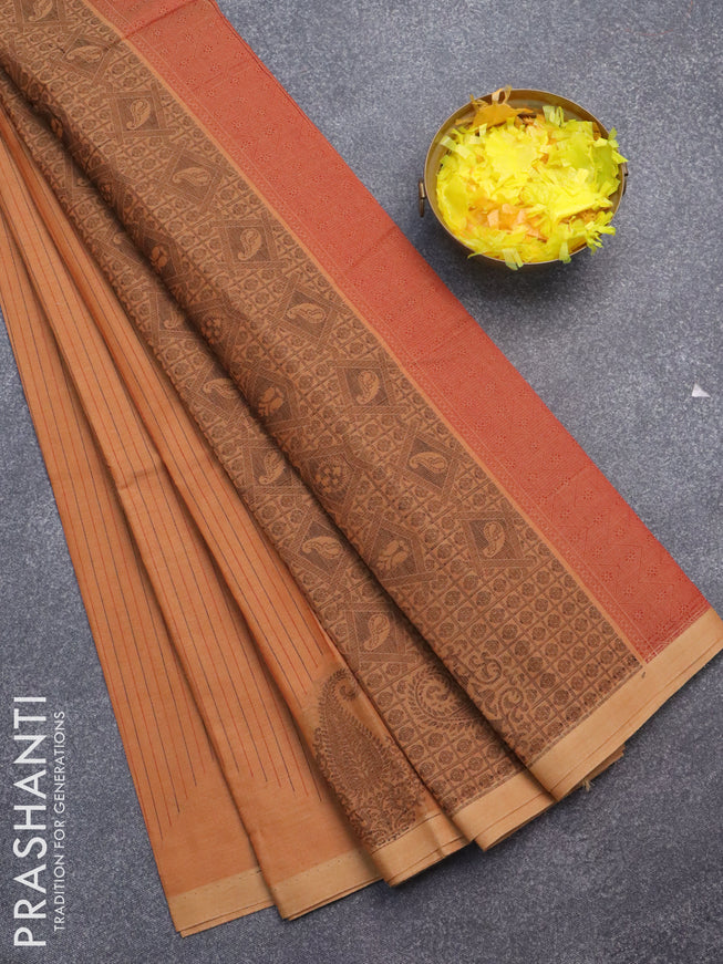 Nithyam cotton saree rustic orange with allover stripes pattern & thread buttas and piping border