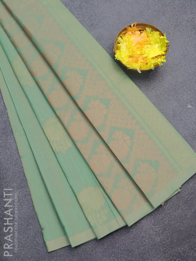 Nithyam cotton saree green shade with allover copper zari weaves & zari buttas in borderless style