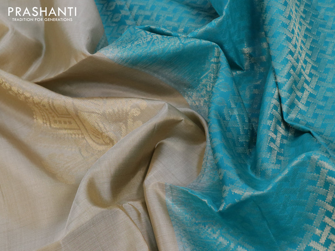 Pure soft silk saree beige and teal blue with silver & gold zari woven buttas in borderless style