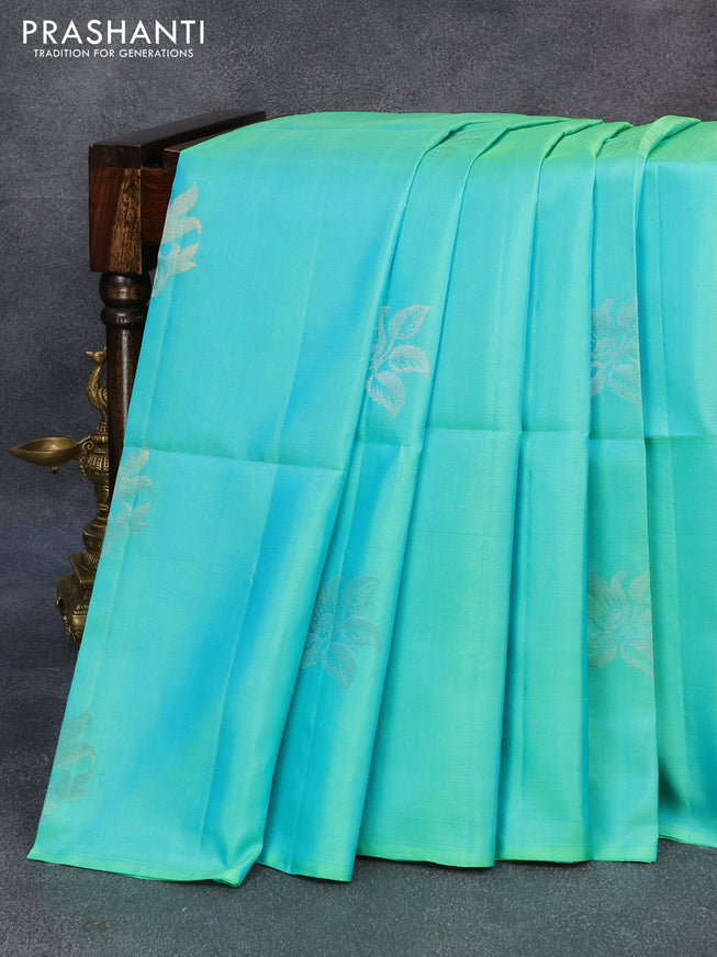 Pure soft silk saree dual shade of teal blue and dual shade of pinkish orange with silver zari woven buttas in borderless style