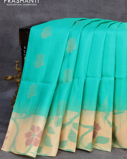 Ikat soft silk saree teal blue and sandal with annam zari woven buttas and ikat style border