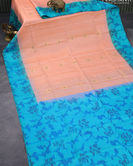 Ikat soft silk saree peach orange and teal blue with zari woven buttas and ikat style border